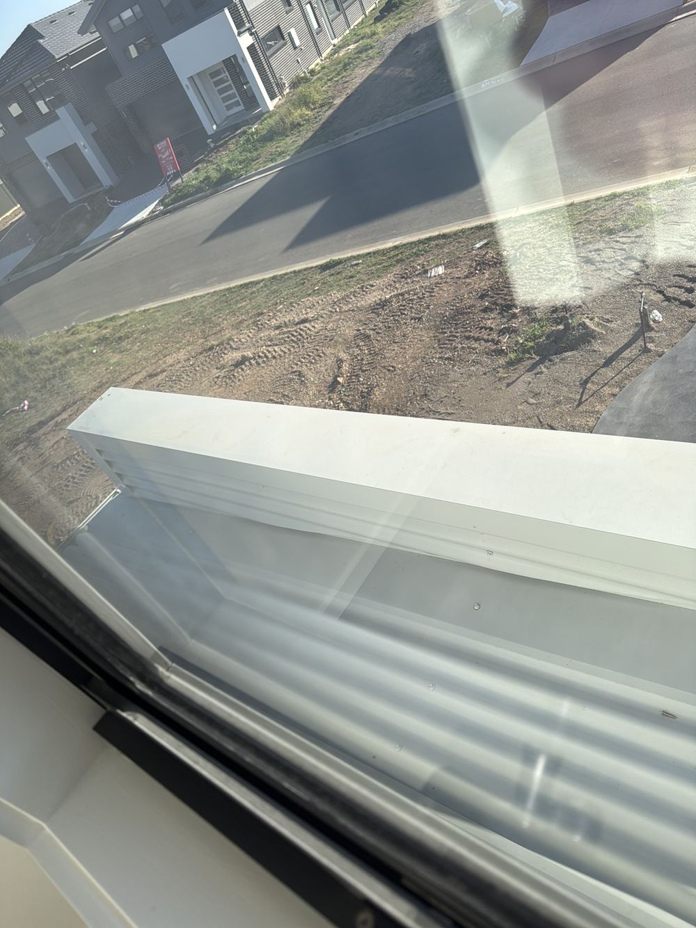 Apron flashing fixed at centres wider than the 500mm maximum, found during a handover inspection in Rouse Hill