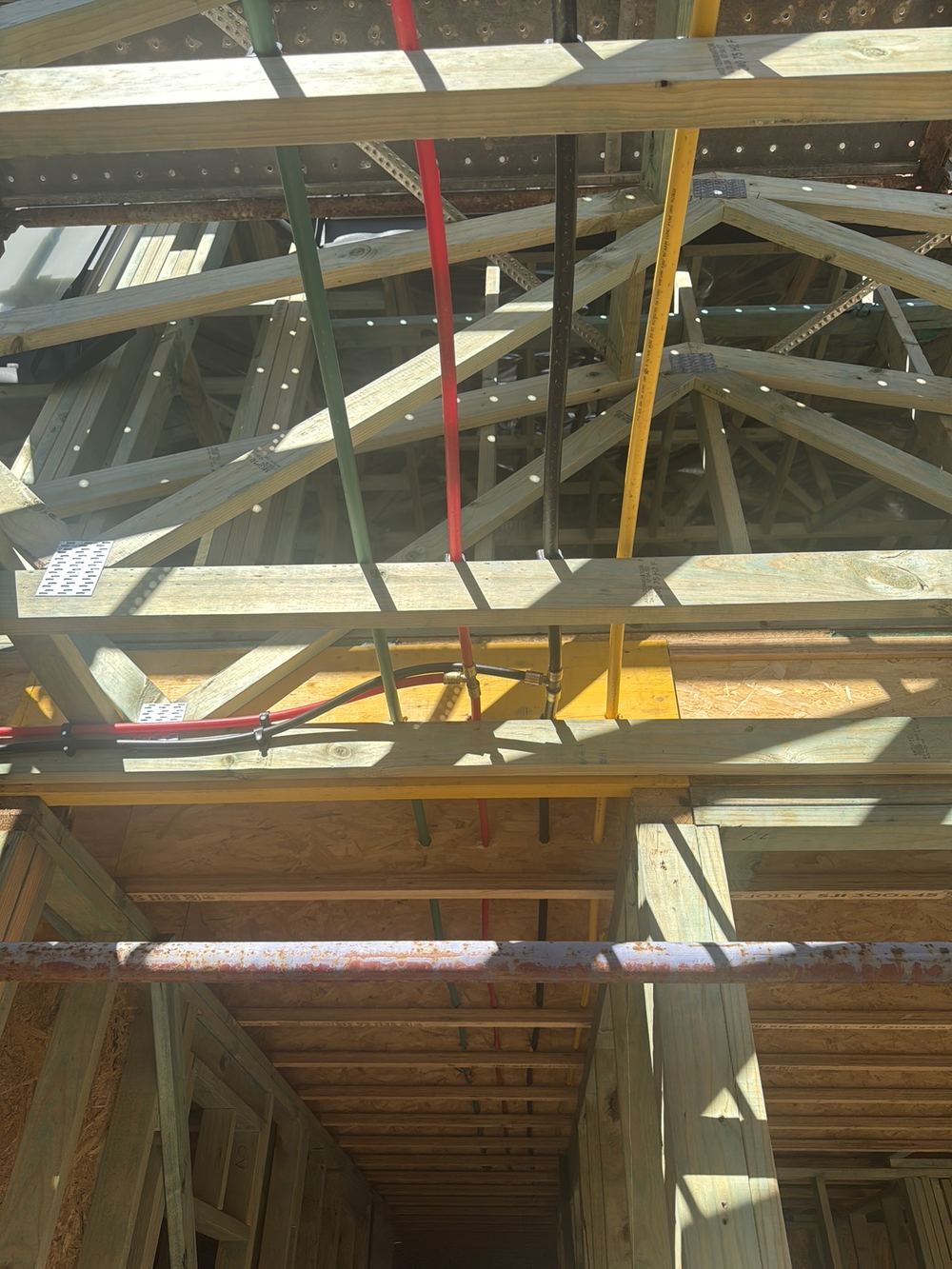 Numerous holes drilled through a timber beam, referred to an engineer to assess, found during a lock-up inspection in Rouse Hill