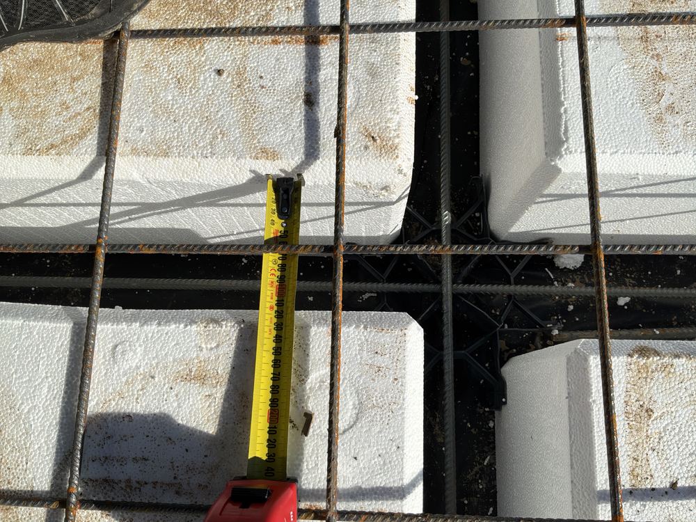 Waffle pods shifted, narrowing a beam below the width shown on the plans, Rouse Hill