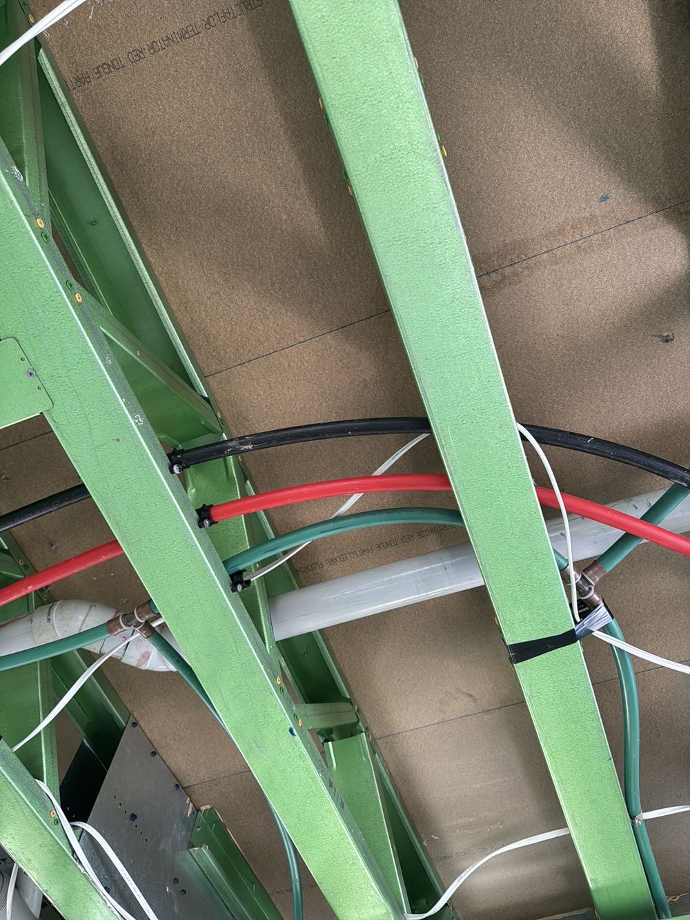 Pipes and cables touching inside Rouse Hill walls before the plaster goes on