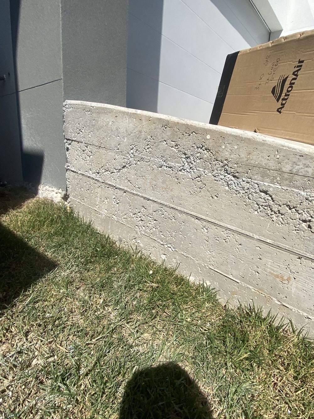 Honeycombing in the driveway surface, showing voids in the concrete, Rouse Hill