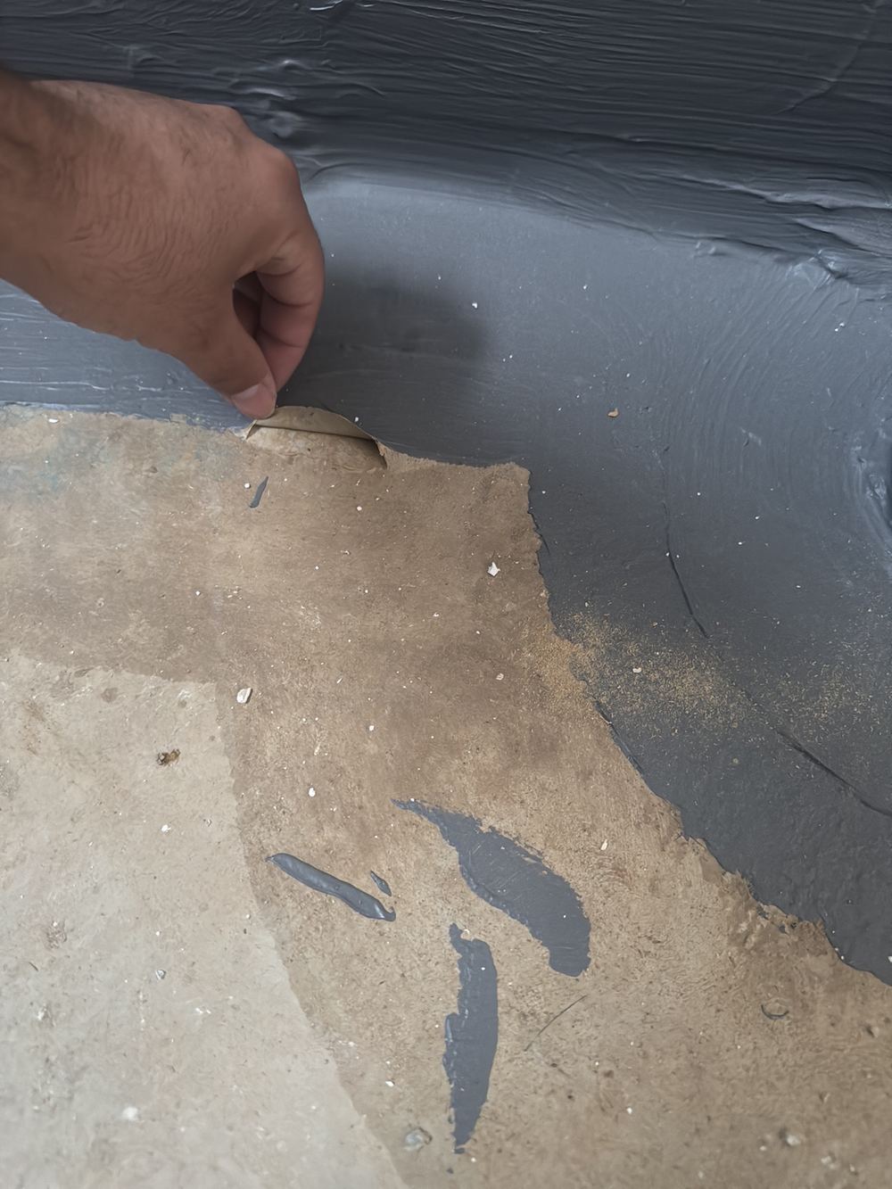 Membrane peeling away easily because it has not bonded to the slab, found during a fixing stage inspection in Rouse Hill