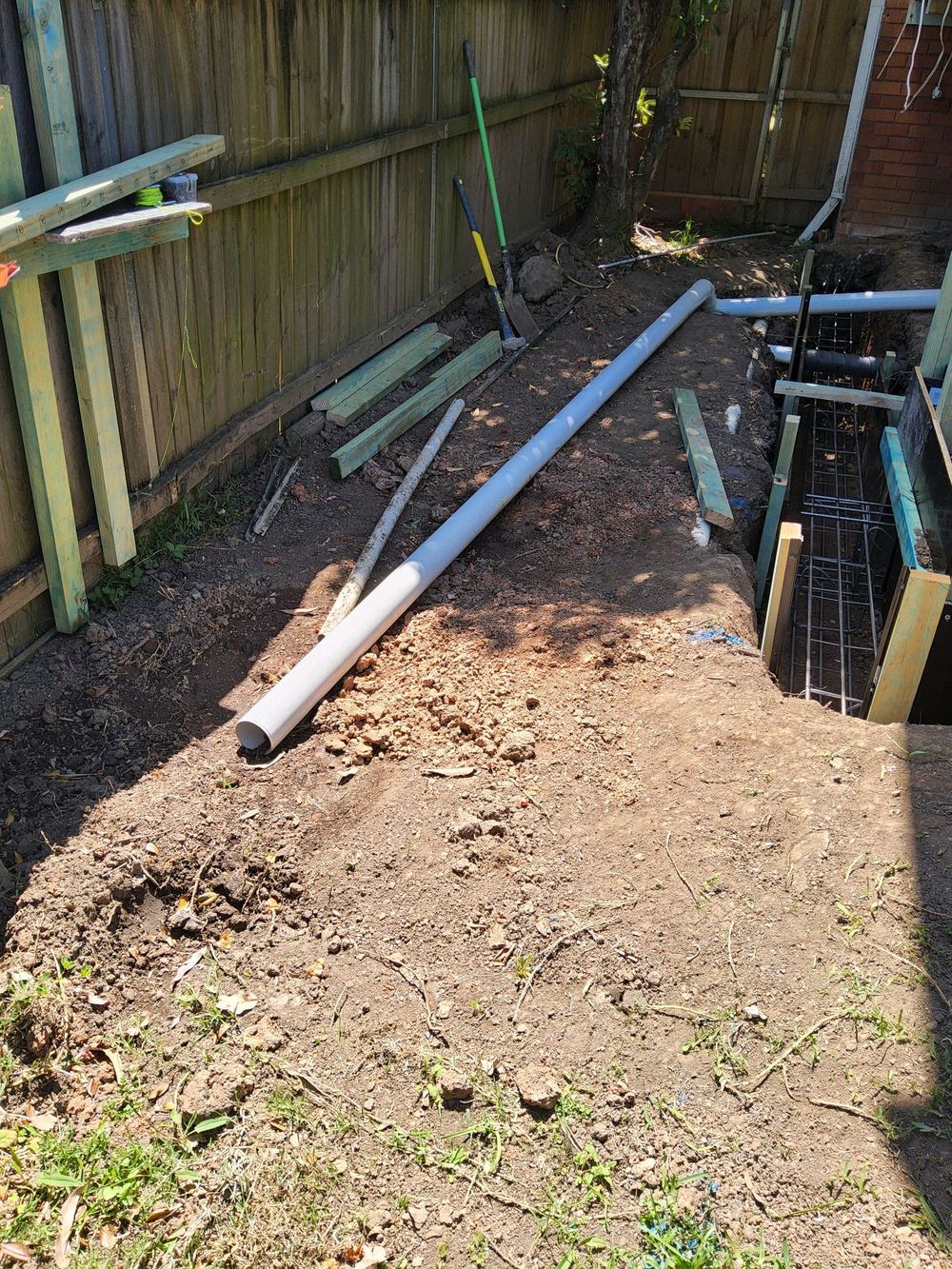 Stormwater line left unbackfilled near the footings, found during a bored pier inspection in Pennant Hills